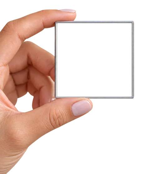 A 2x2 magnet held in a hand